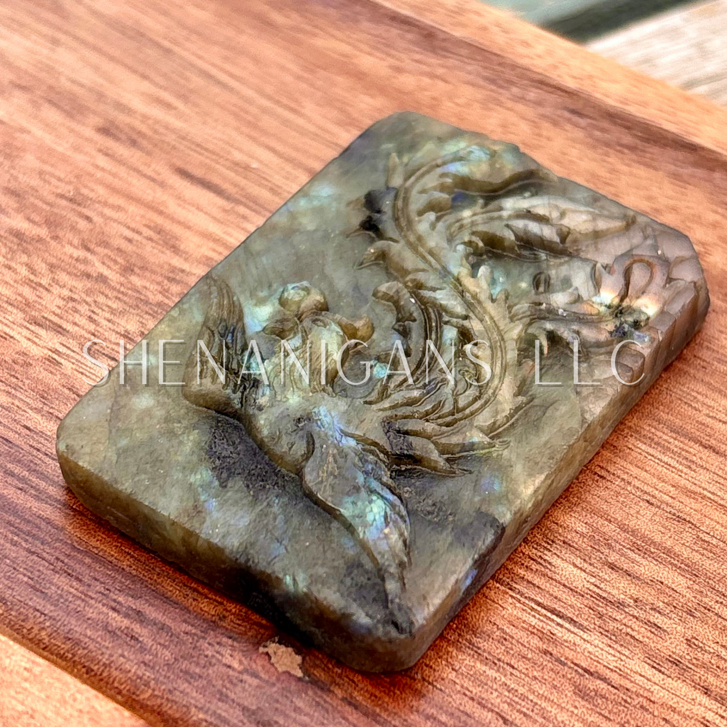 Flat carving labradorite peacock