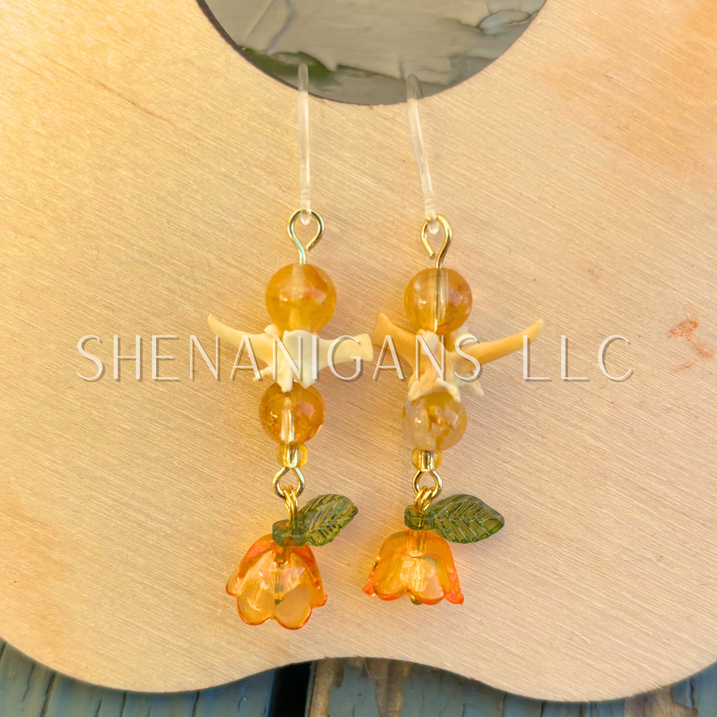 Orange and Gold Bell Flower Dangle Earrings with Snake Vertebrae and Crystal Beads
