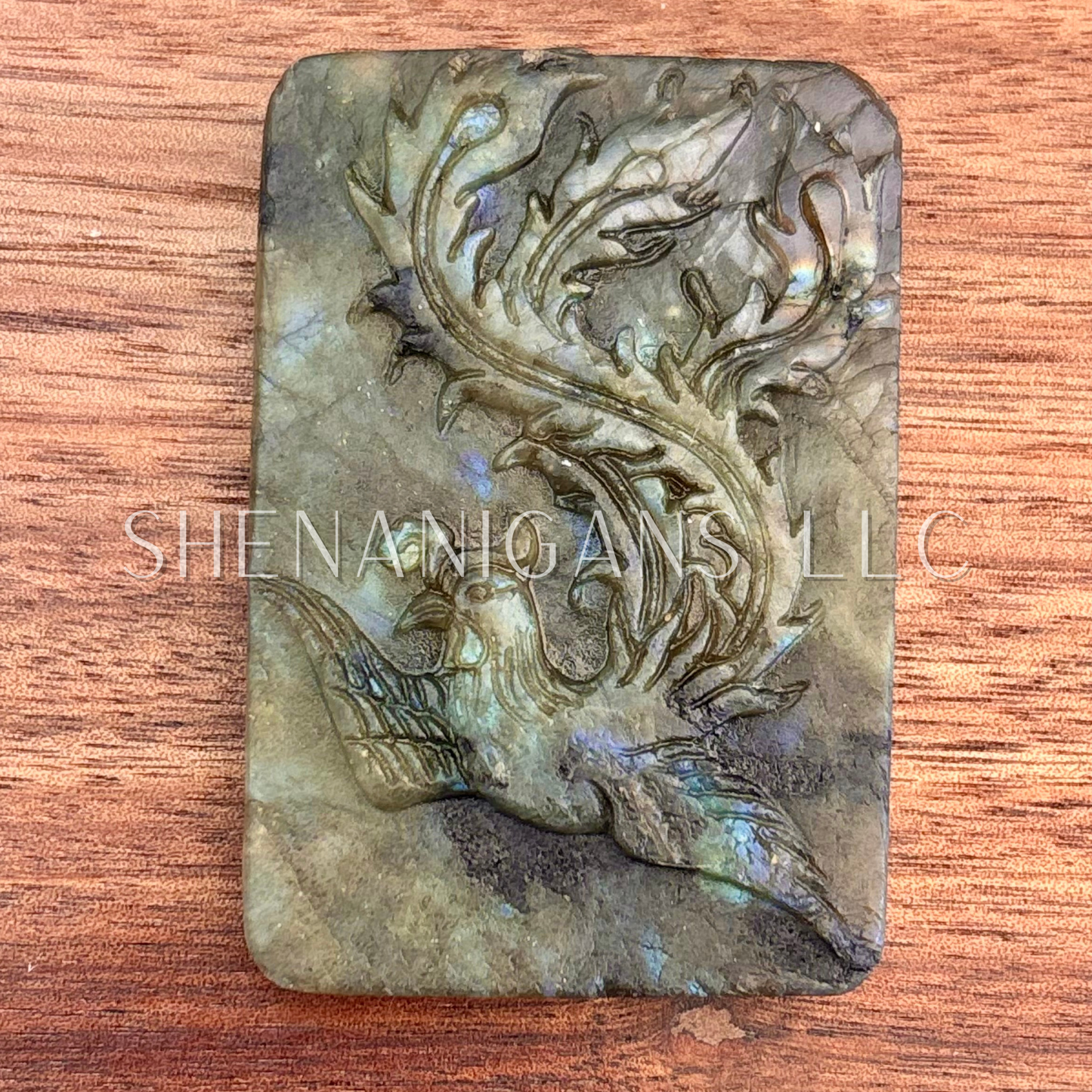 Flat carving labradorite peacock