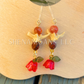 Red and Gold Bell Flower Dangle Earrings with Snake Vertebrae and Crystal Beads