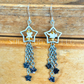 Shooting Star Earrings with Rhodonite Stars & Rattlesnake Vertebrae – Handmade Celestial Coffin Display
