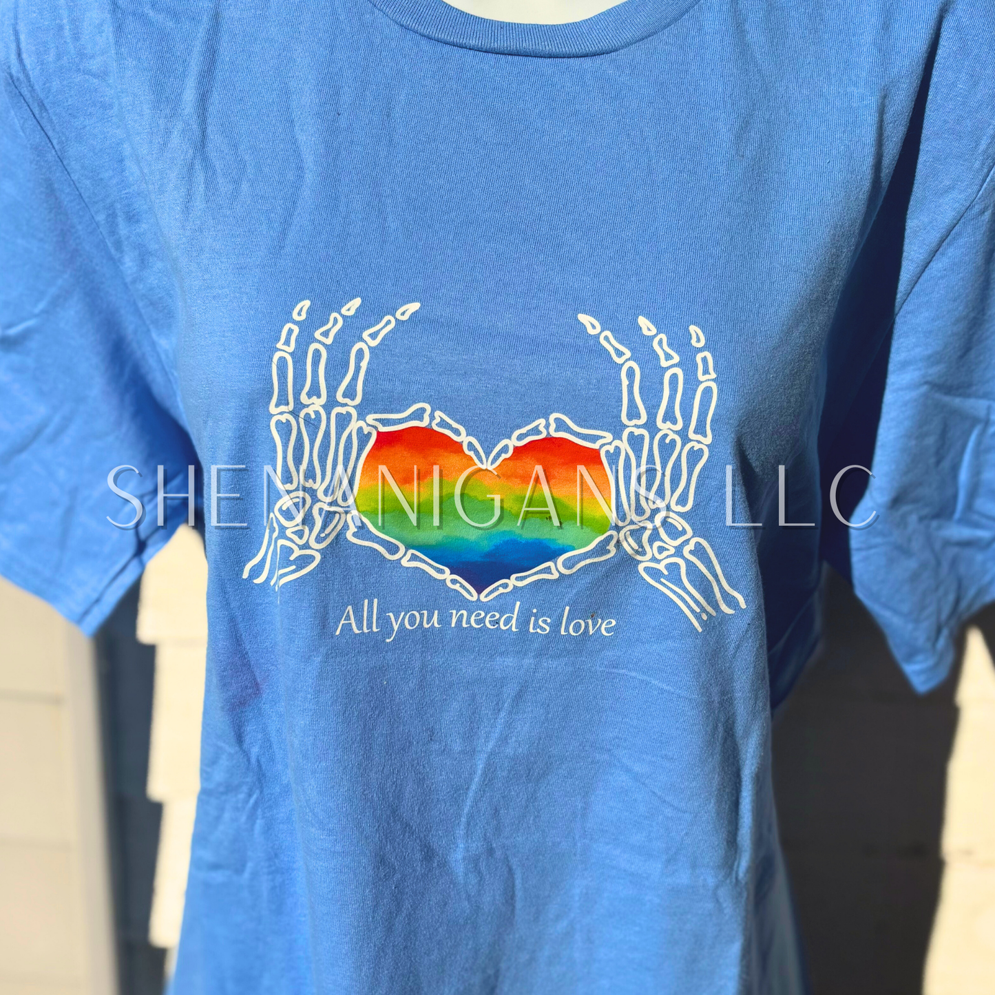 DISCONTINUED: All you need is love - pride skeleton hands apparel